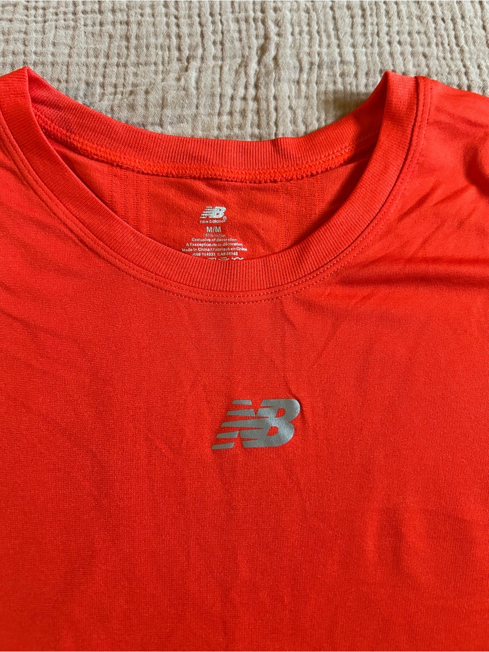 New Balance Men’s Bright Red Short Sleeve Crew Shirt with Reflective Logo
